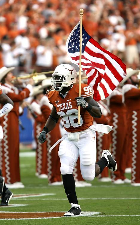 Football player running with American flag