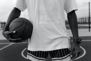 Man-holding-basketball