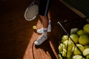Man standing with a tennis racket