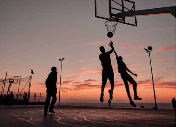 Men playing basketball