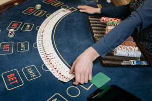Dealer laying cards on a poker table