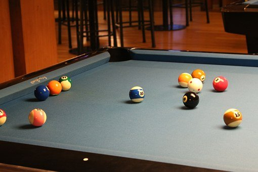 Snooker balls scattered at the table