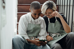 Two women looking at a smartphone