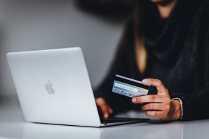 A person holding a credit card.