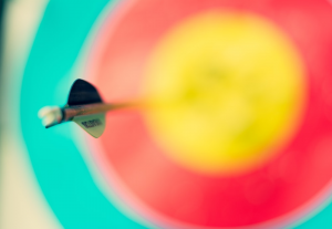 Close up shot of an arrow hitting bull’s eye