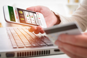A person watching the score on phone