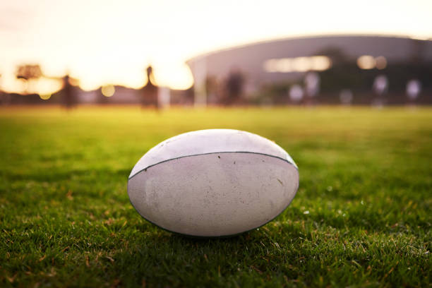 A Rugby ball placed on the ground of the stadium