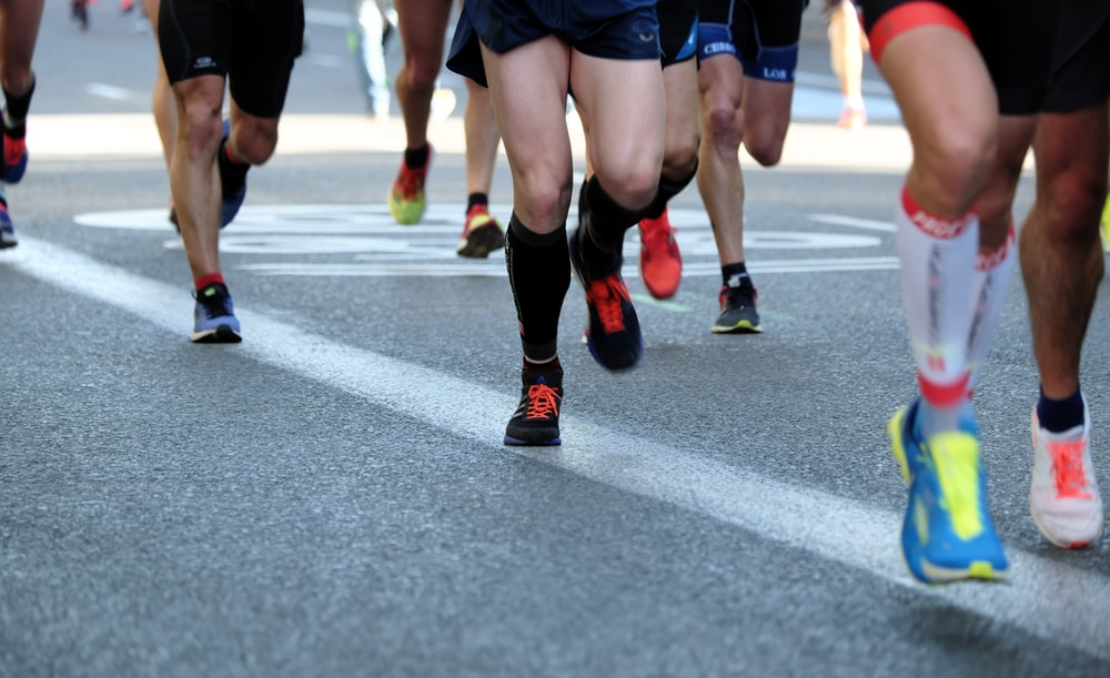 Shot of runners’ legs at a marathon