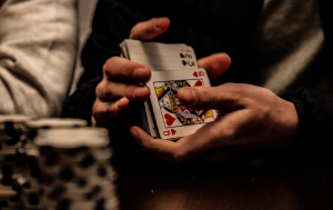Close up of a person shuffling a deck of playing cards
