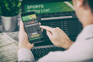 sports betting on phone and laptop
