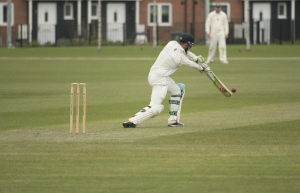 Cricket player batting during a test match