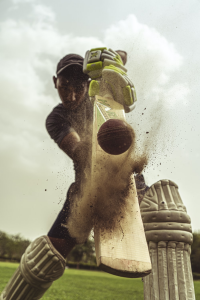 Close up of a batter hitting the ball