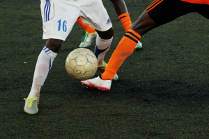 Two athletes playing football