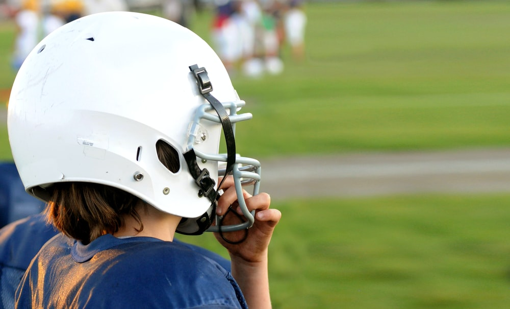 A person wearing a football helmet