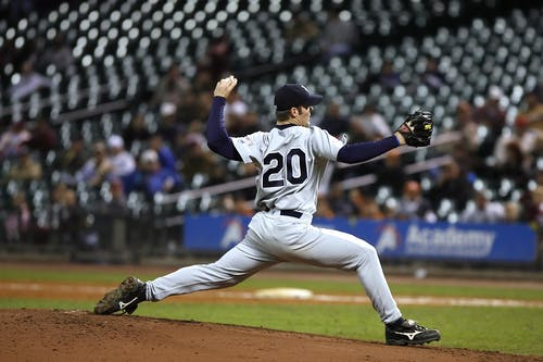 Baseball player set to throw a ball during MLB