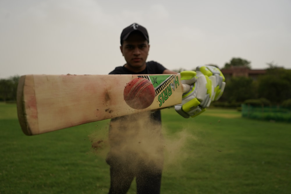 A cricket batsman hitting a ball