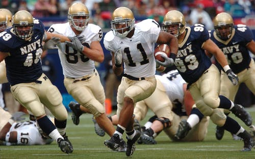 Football players running after the ball