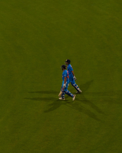 Indian batsmen walking down the crease.