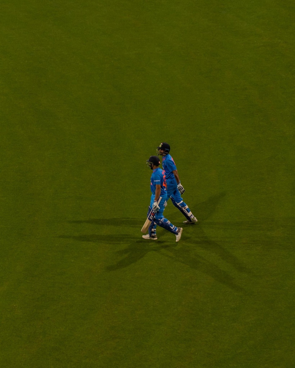 Indian batsmen walking down the crease.