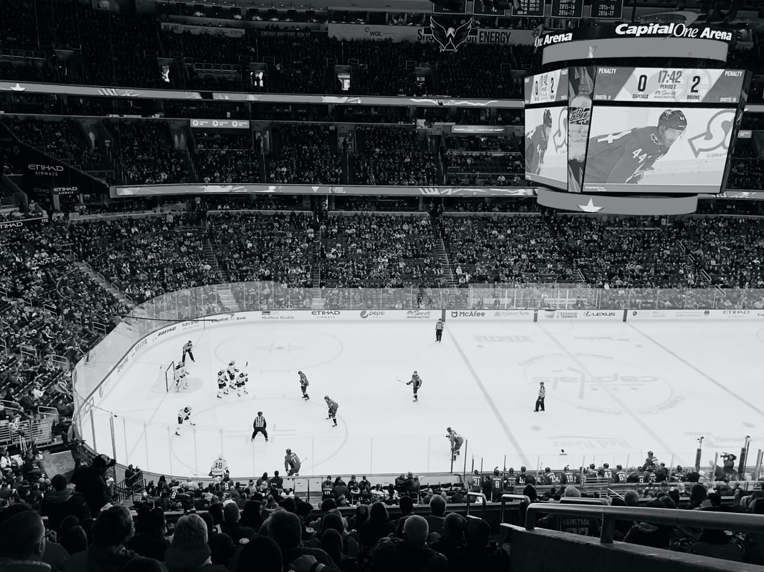 Players in an ice hockey rink