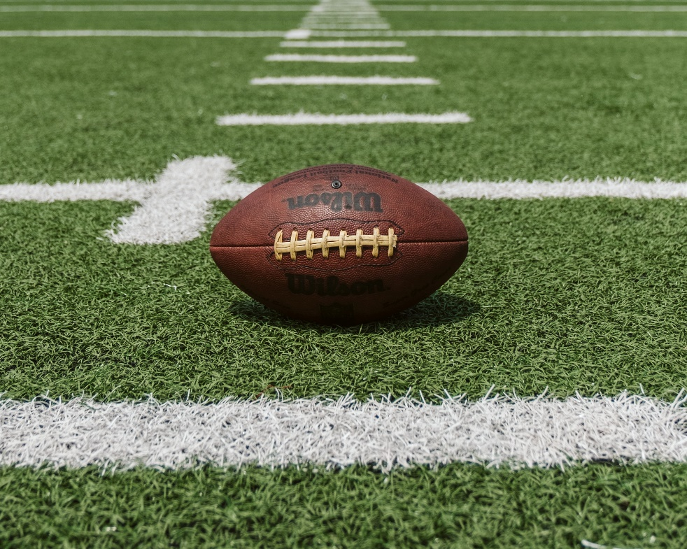 An NFL ball on the ground.