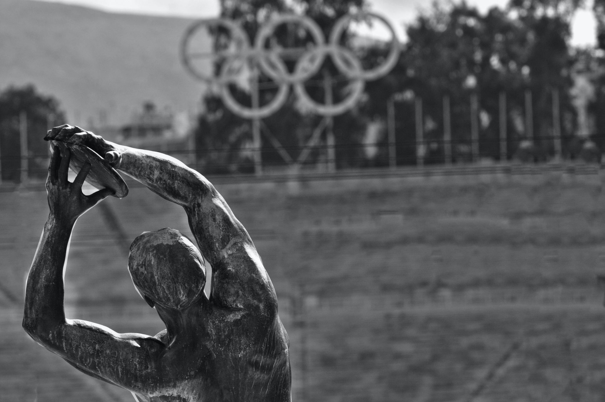 A black and white picture of an Olympic figure