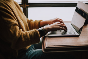 A punter reading reviews to check online gambling website's security