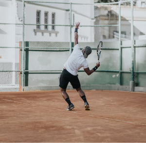 A tennis player serving