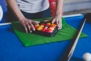 Man fixing billiard balls