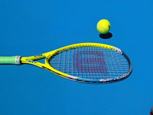 A tennis ball and racket