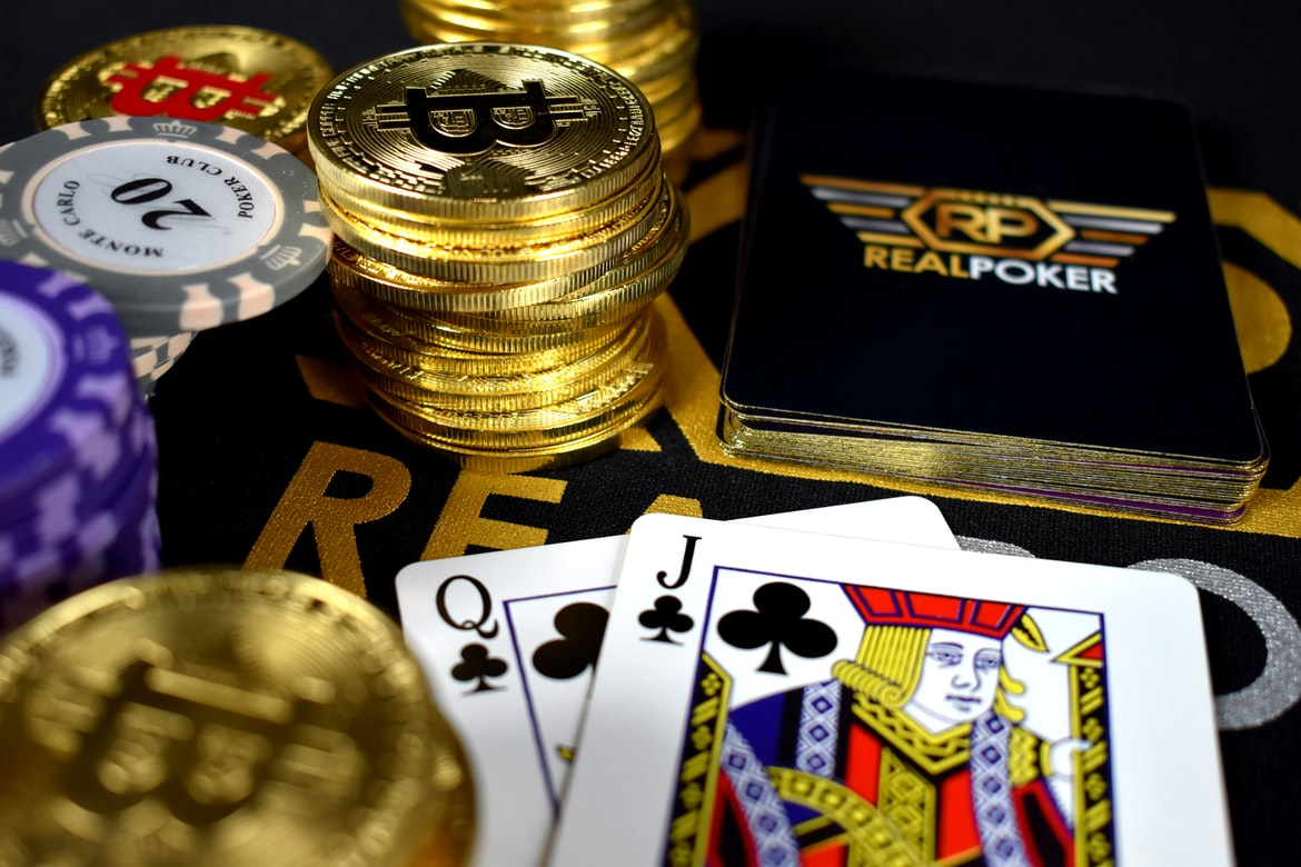 Poker cards, chips, and coins on a table