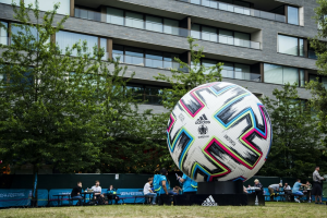 A giant UEFA football monument at a football field