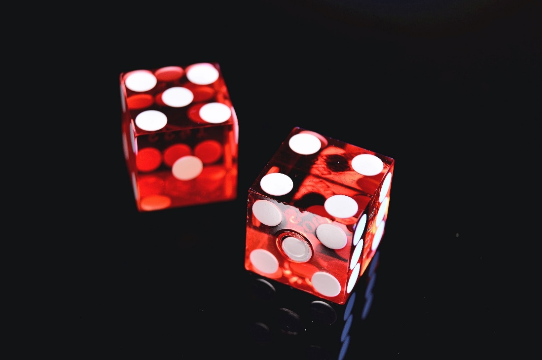 Two red dice on the surface.