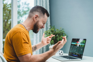 A man watching football and betting live