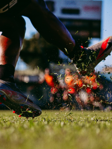 person-sneakers-field