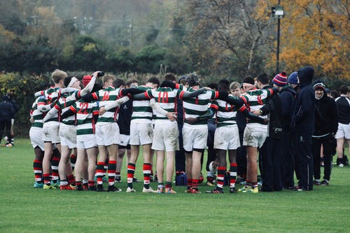 Rugby players in a huddle