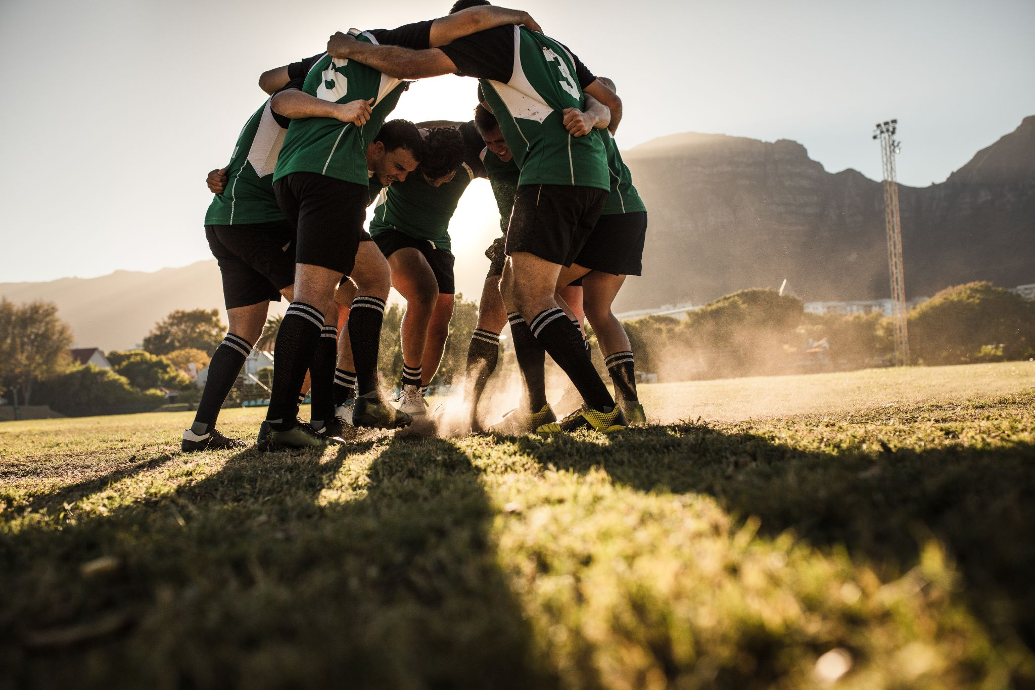 Rugby players in a huddle