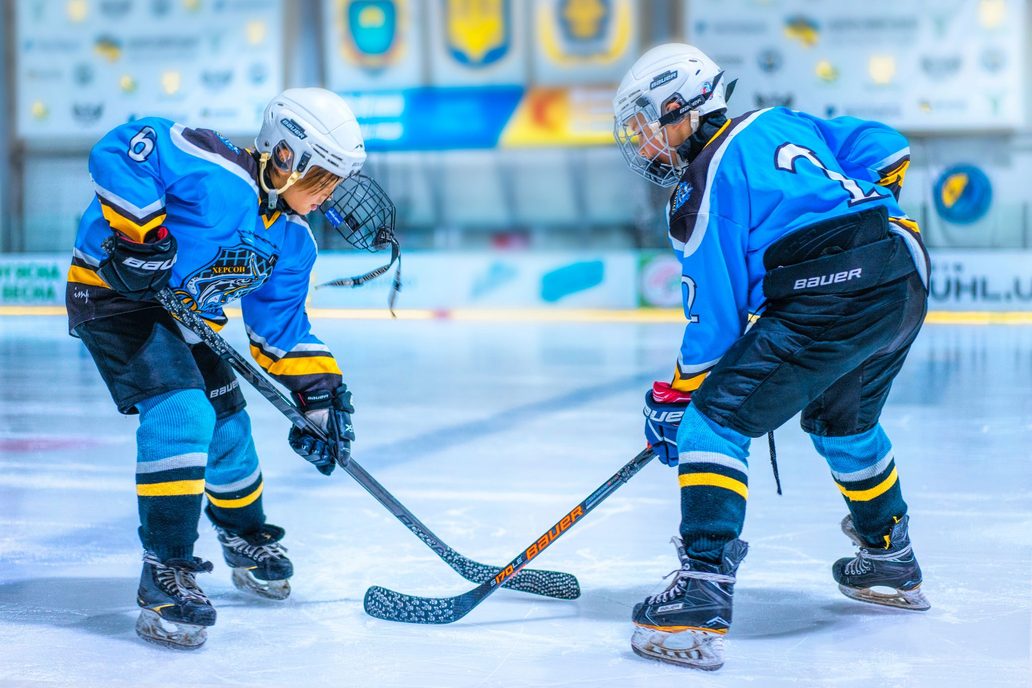 Two ice hockey players on an ice rink