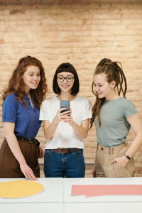 women looking at smartphone