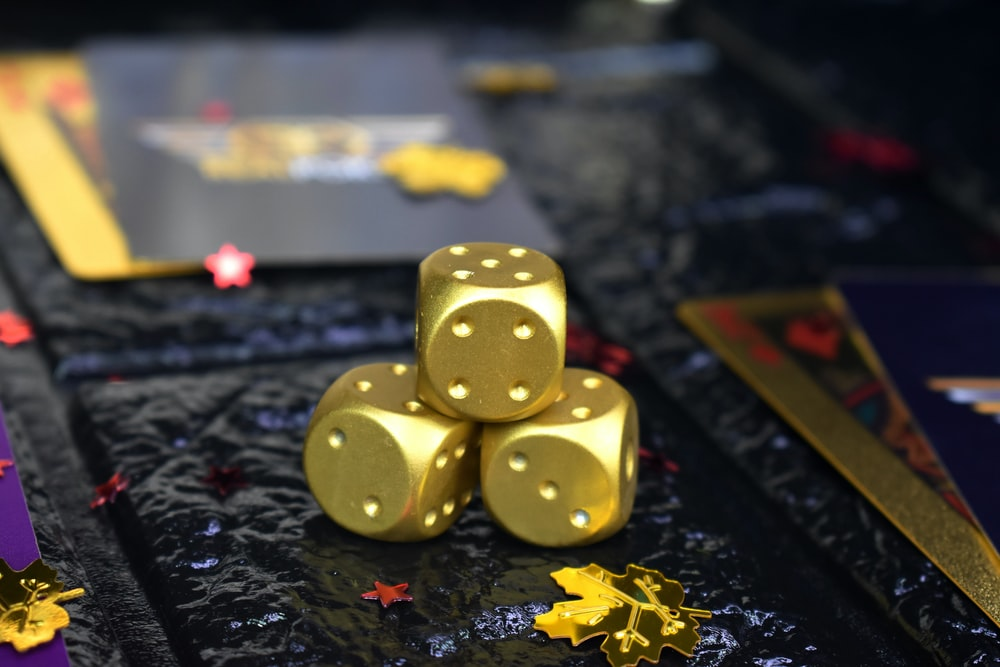 Three gold poker dice