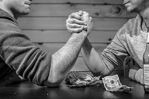 Betting money on arm wrestling
