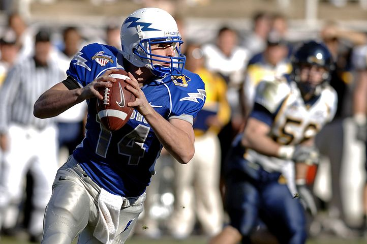 Football player throwing ball