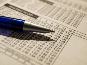 a pen on a betting sheet