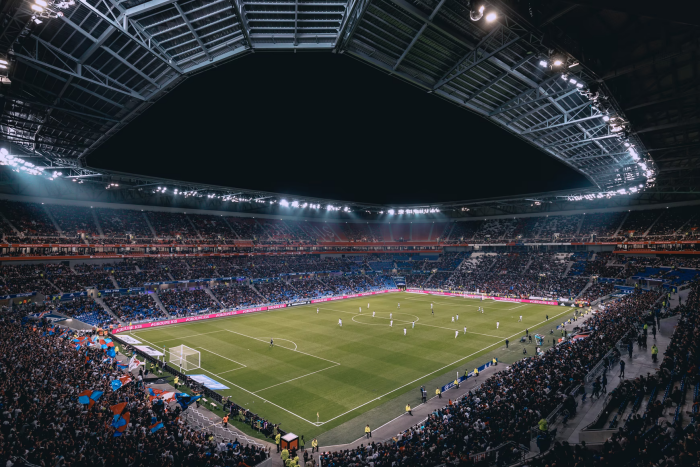 A soccer match being played in a stadium