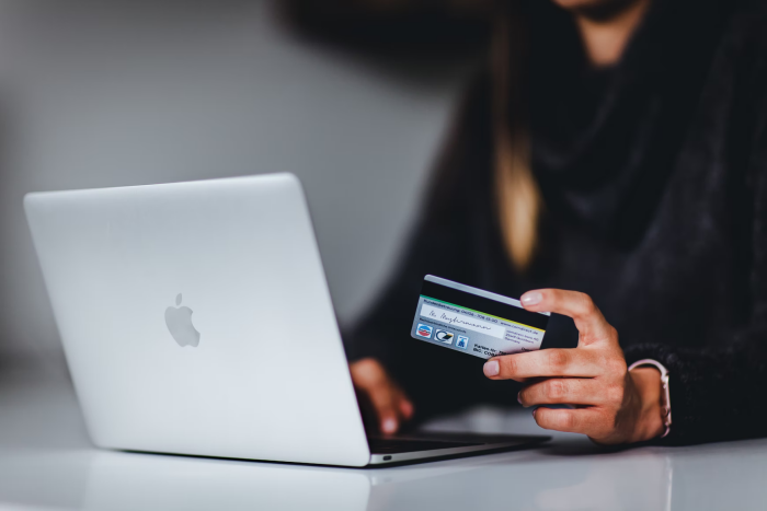 A woman registering her card on an online betting site