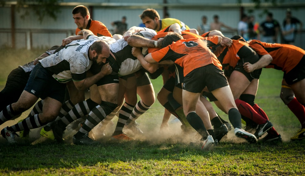 Players from competing rugby teams going head-to-head