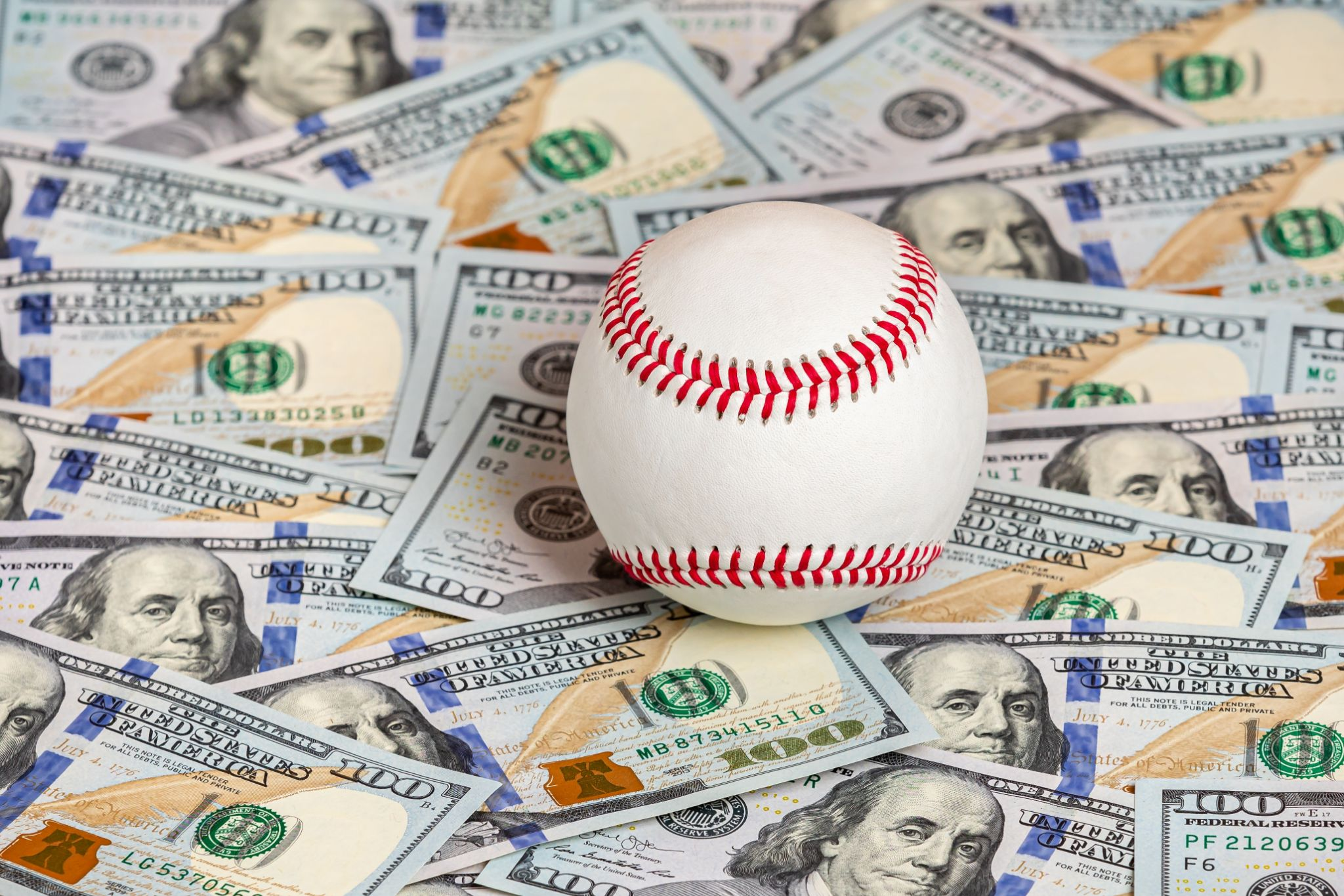 Money under a baseball