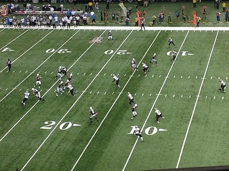 Teams playing at the football field