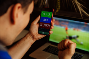 A man winning after betting online