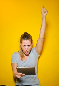 a woman holding an iPad